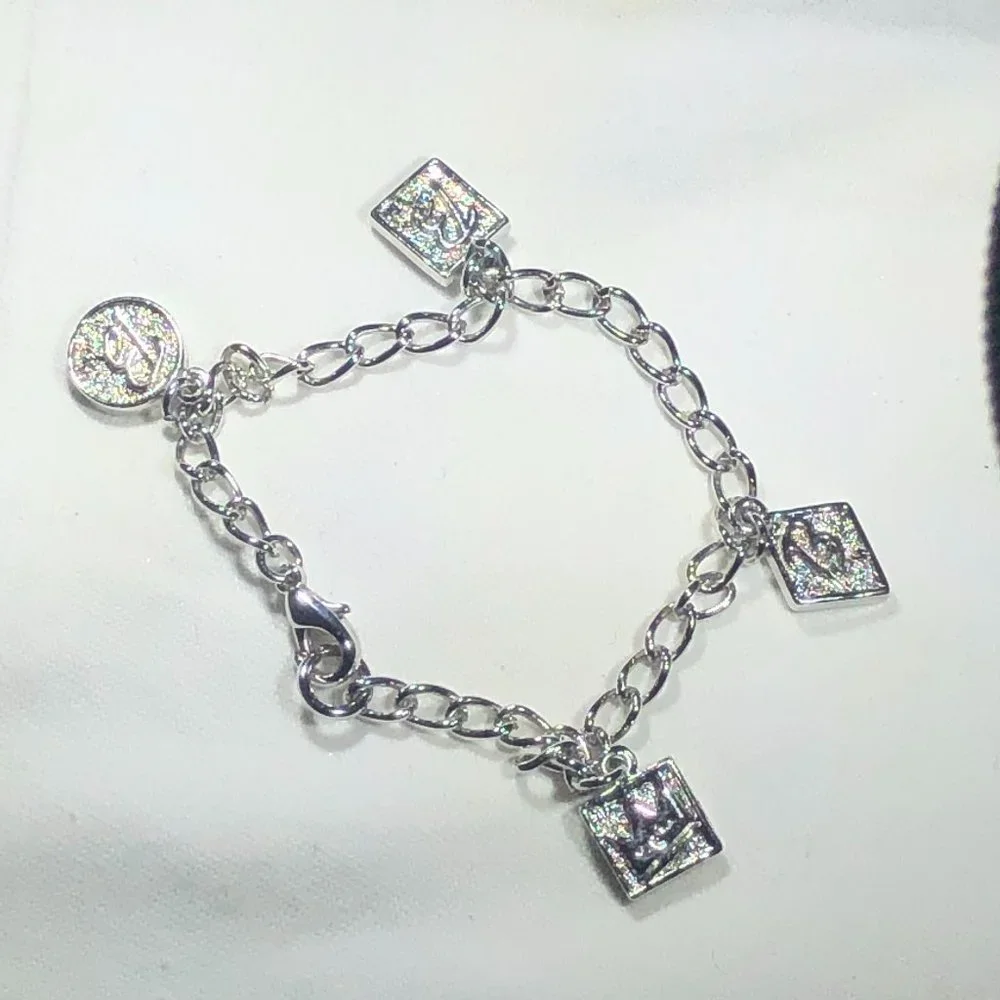 SILVER TONE BARBIE CHARM BRACELET